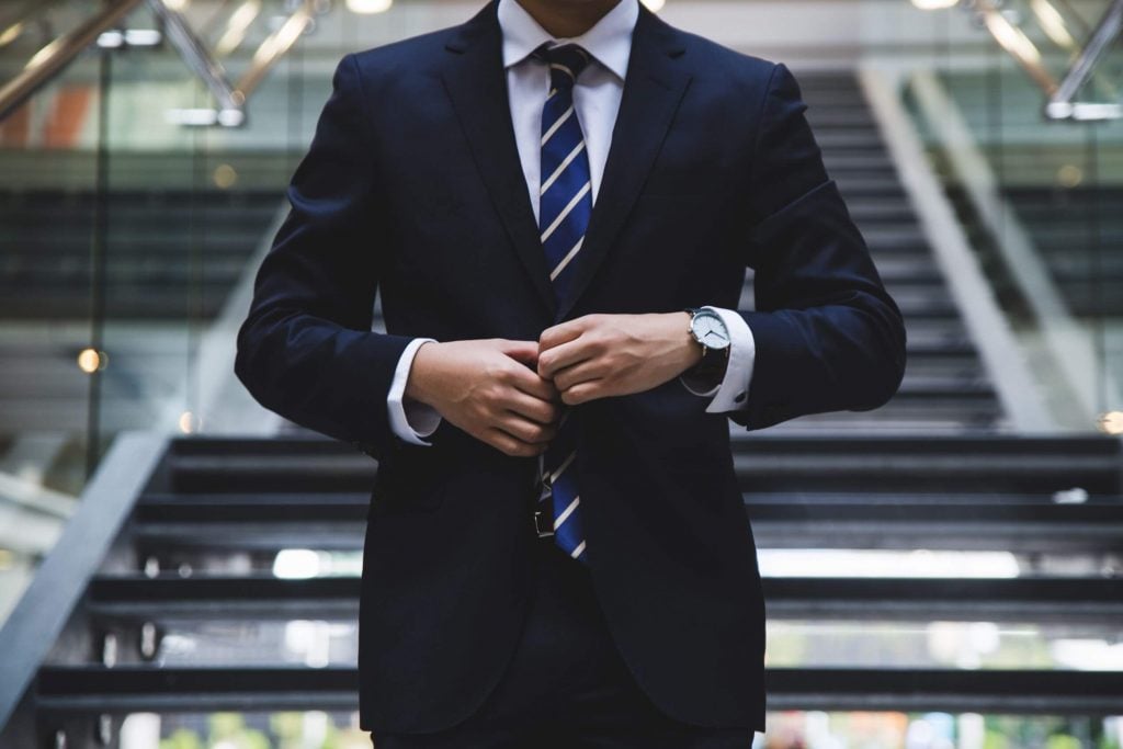 gifts for business travelers feature image - business man walking down steps