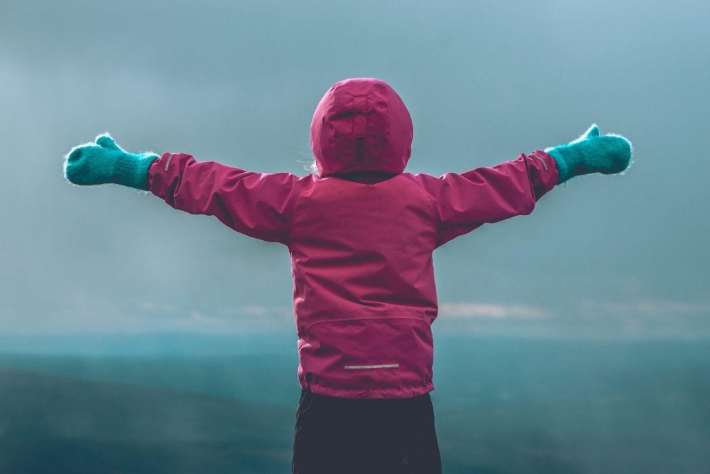 travel gifts for kids feature image - kid in nature