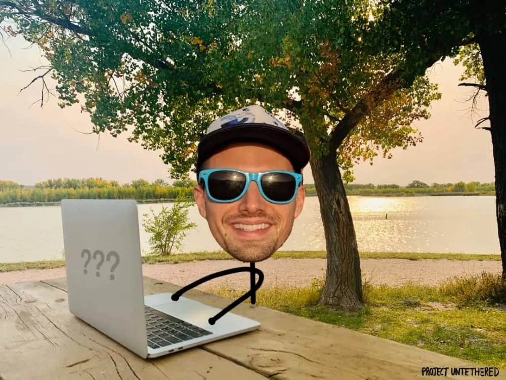 laptop set on a table with lake background