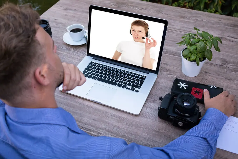 man watching a video on laptop