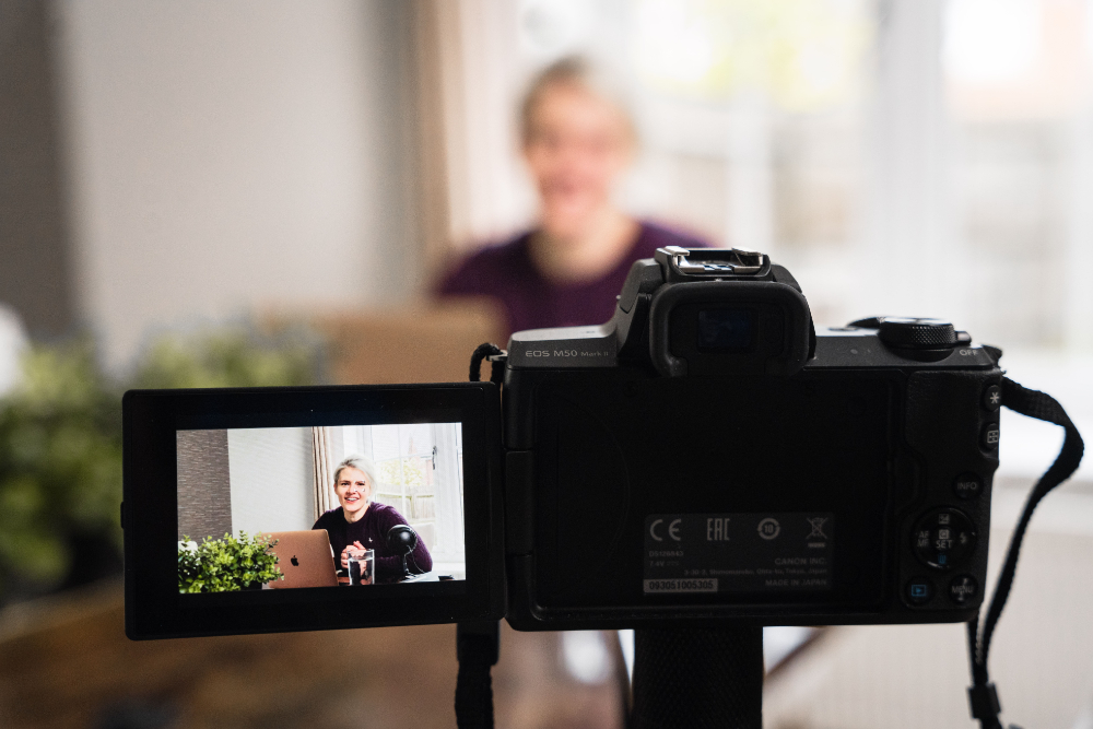 woman filming herself in front of camera