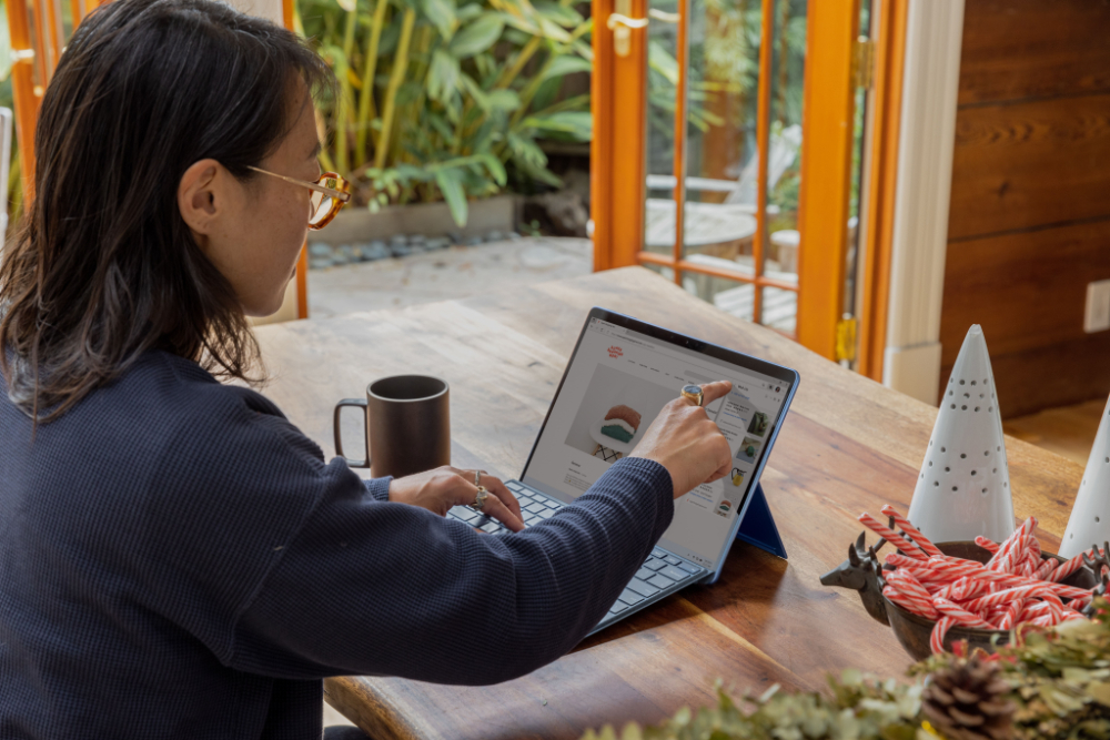 woman pointing at a computer screen
